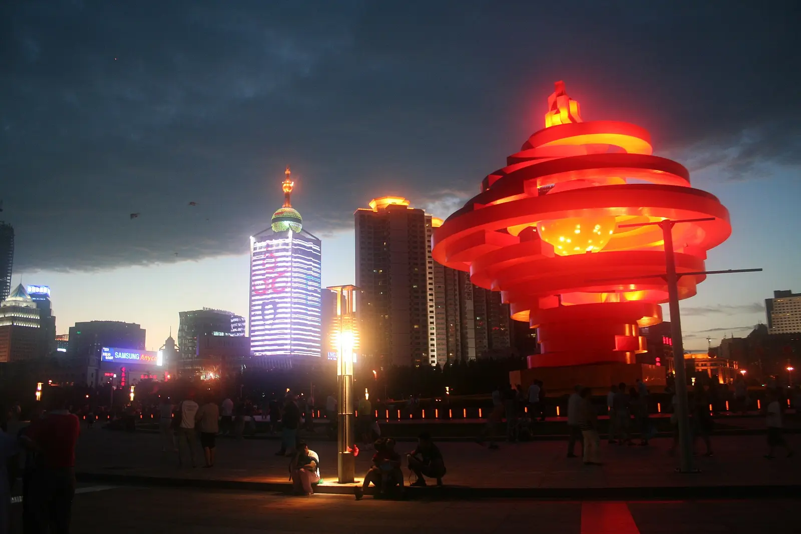 The Wind of May sculpture at May Fourth Square in Qingdao at twilight